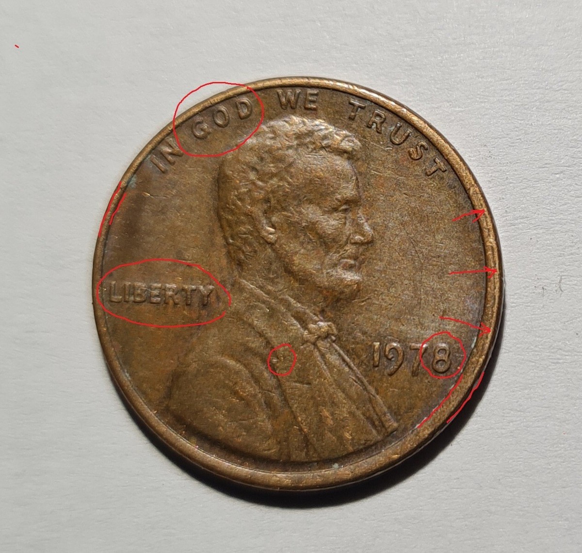 1978 penny off-center strike error showing partial Lincoln portrait and blank crescent-shaped area