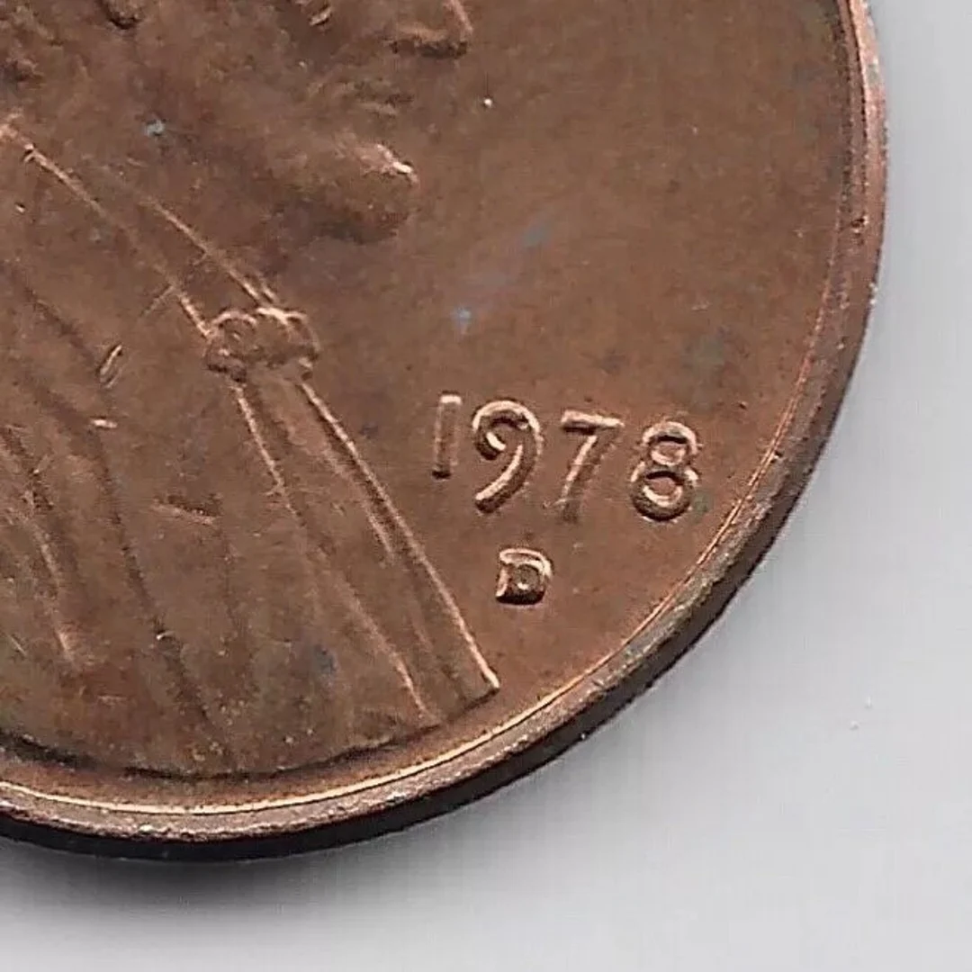 1978-D penny repunched mint mark error showing secondary ghost D impression below the primary mint mark